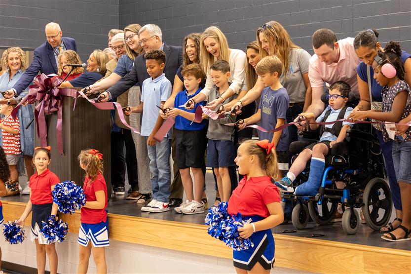 Students cut ribbon at new school